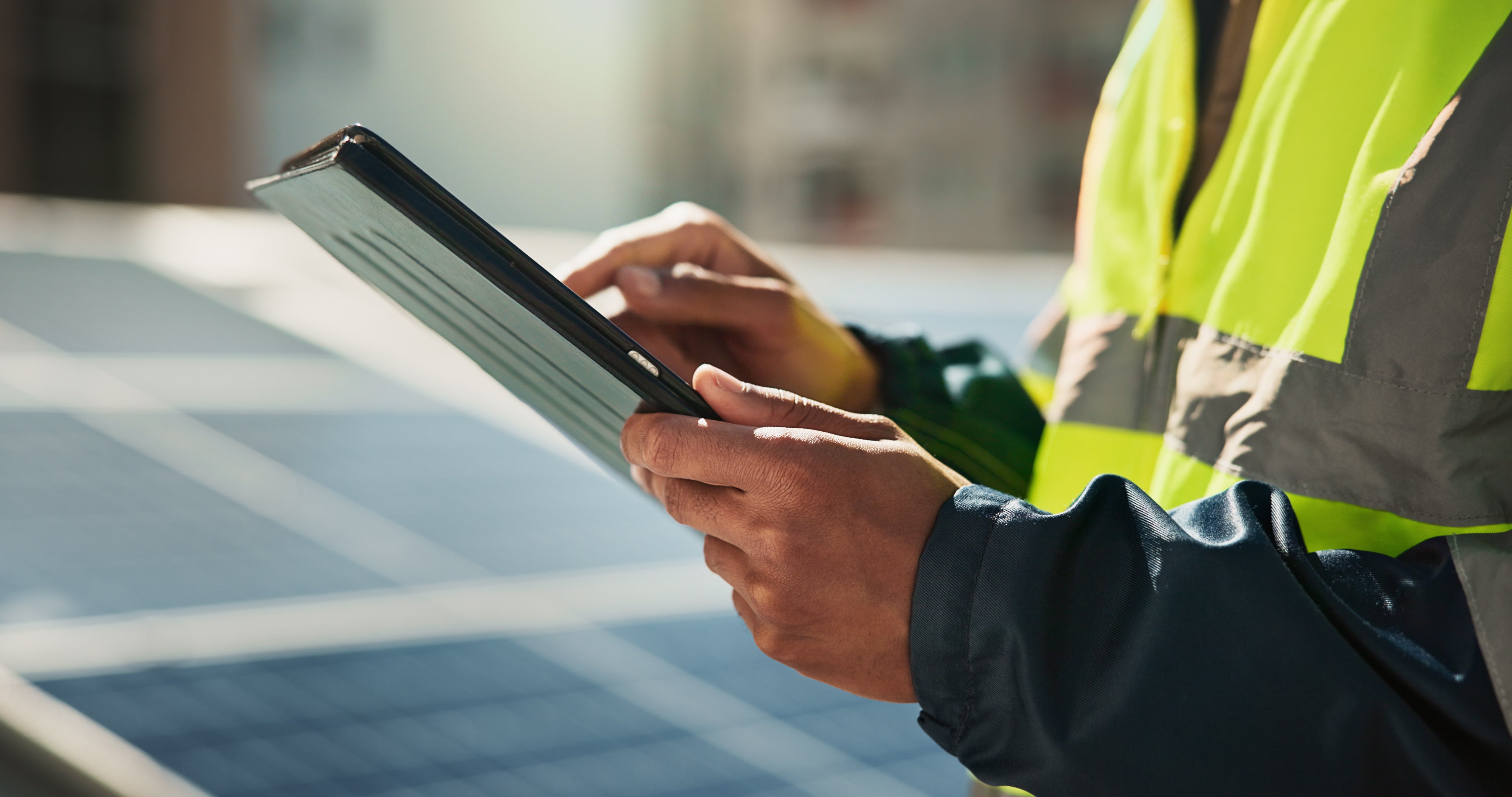 Clean energy professional reviewing information on a tablet